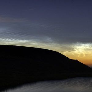 The strange summer night-sky phenomenon of noctilucent clouds.